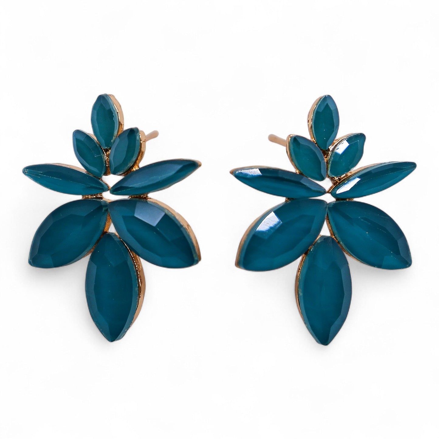 Teal green vintage glass flower earrings glowing like fresh spring leaves, styled on white linen with moss and tiny forest flowers