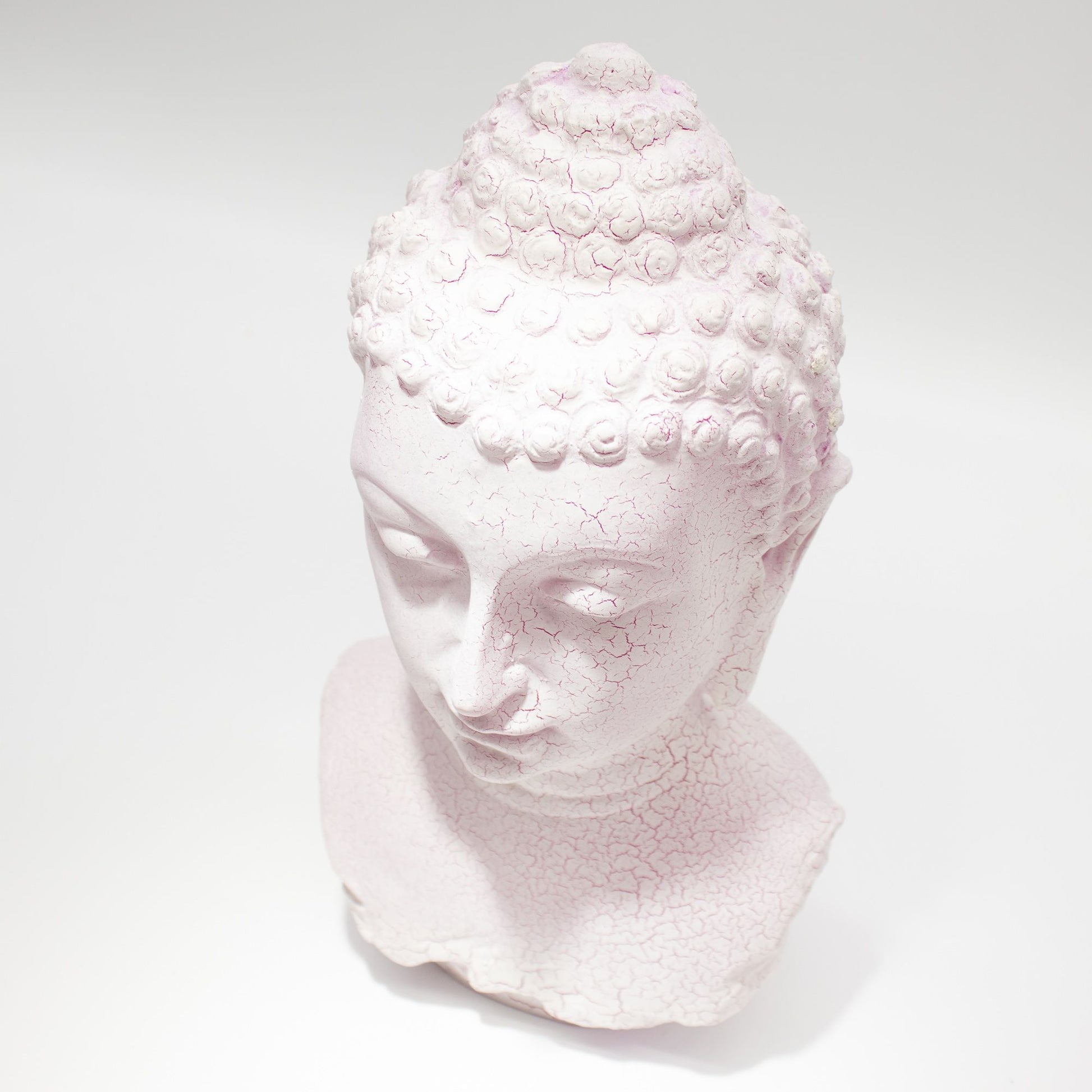 Buddha Bust Lamp with crackle textured surface on modern oval stand