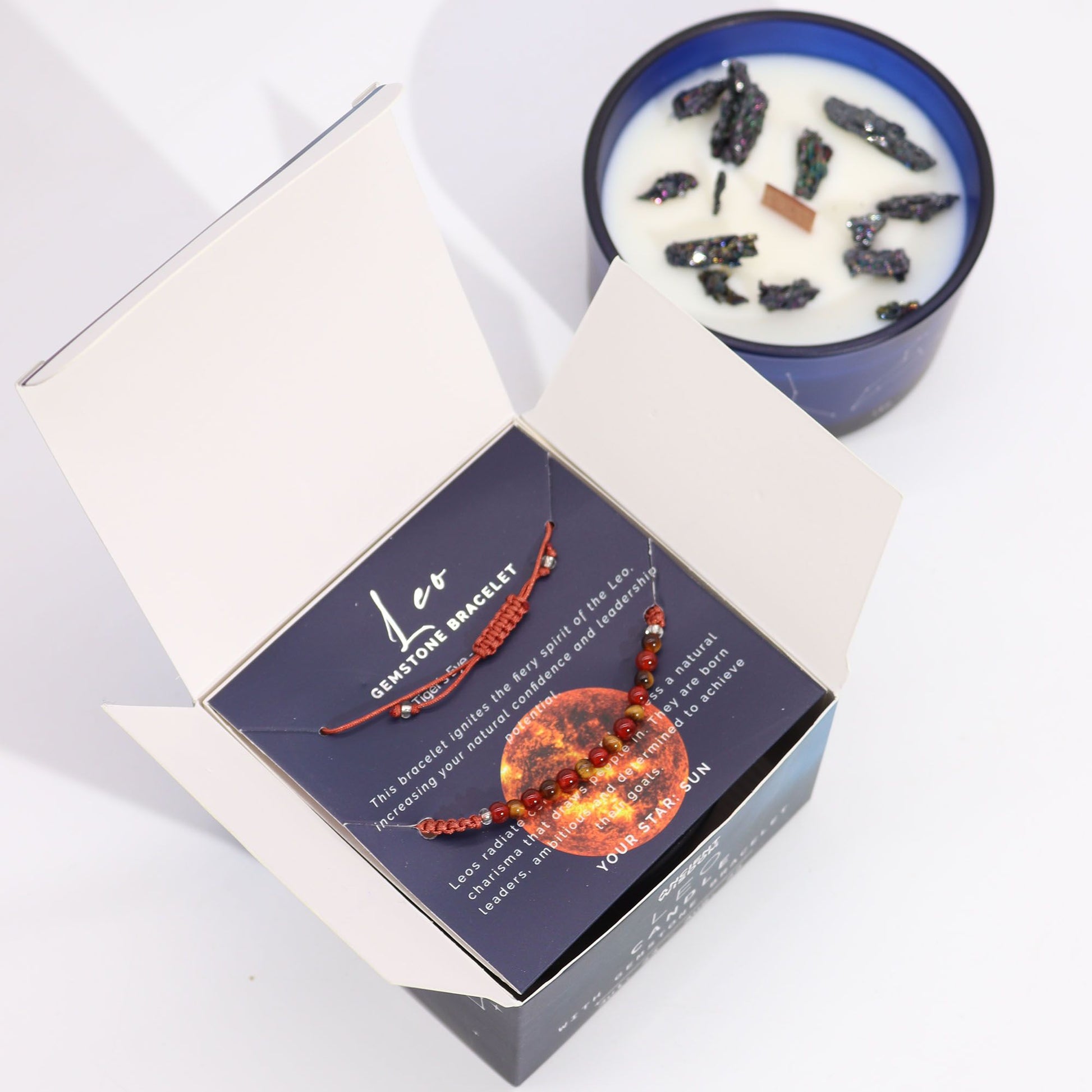 Bracelets in a box with a candle in the background