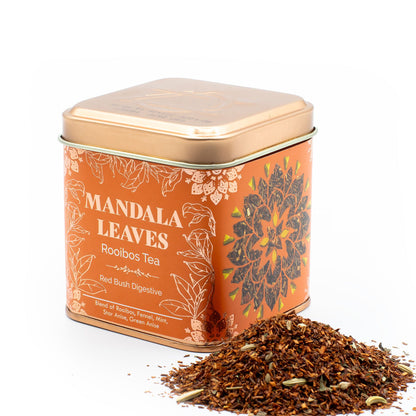 Tea canister labeled 'Mandala Leaves Rooibos Tea' with loose tea leaves on a white background