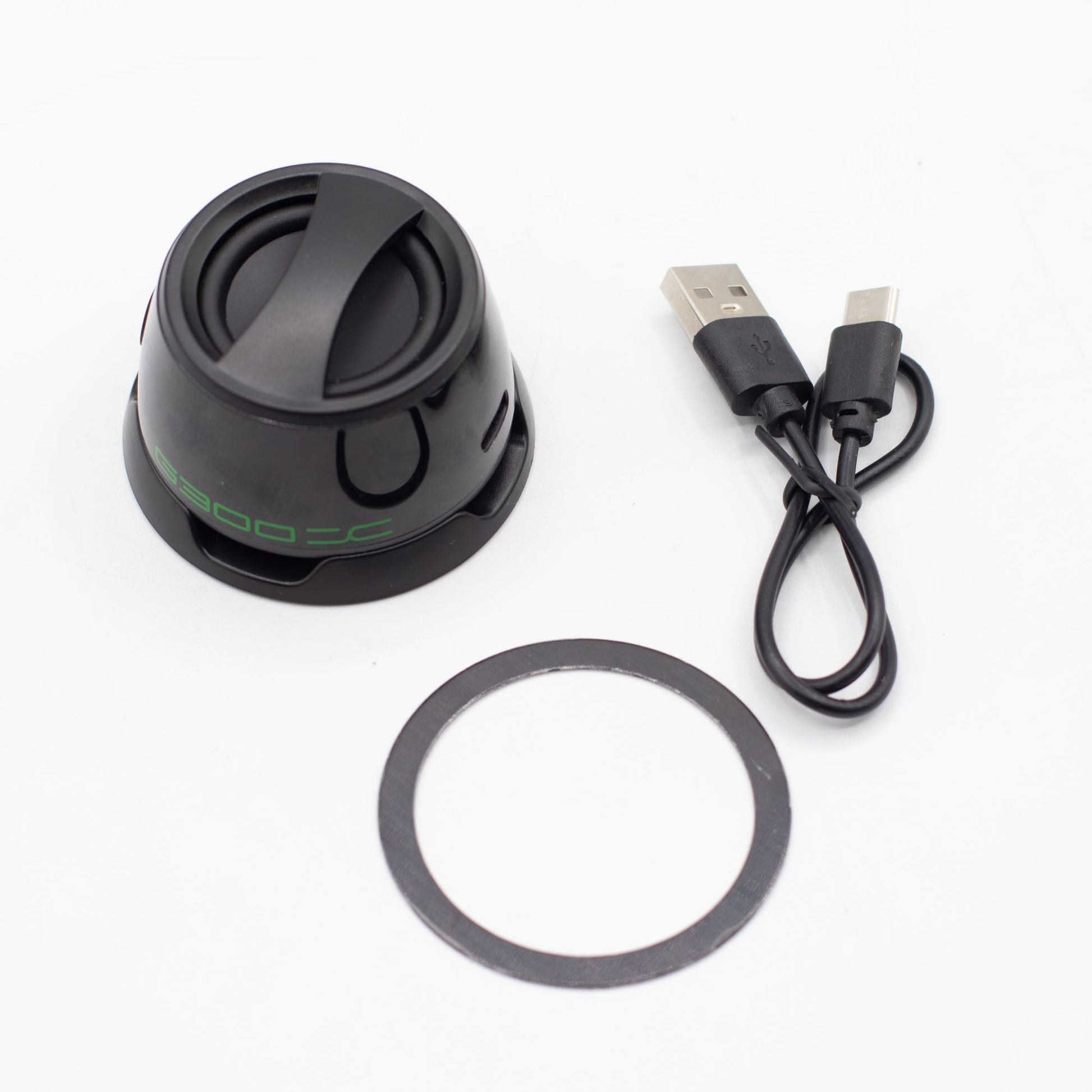 Close-up of G300 speaker showing magnetic attachment, 5W speaker grille, top controls and LED lighting detail