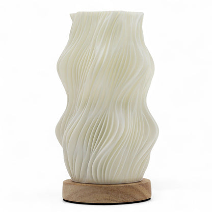 Star Twisted New Wave USB-C lamp with textured honeycomb surface and elegant star-inspired twisted shape, warm glow on 3rd brightness setting, placed on wooden base