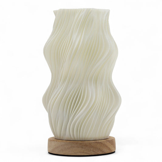 Star Twisted New Wave USB-C lamp with textured honeycomb surface and elegant star-inspired twisted shape, warm glow on 3rd brightness setting, placed on wooden base
