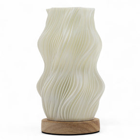 Star Twisted New Wave USB-C lamp with textured honeycomb surface and elegant star-inspired twisted shape, warm glow on 3rd brightness setting, placed on wooden base