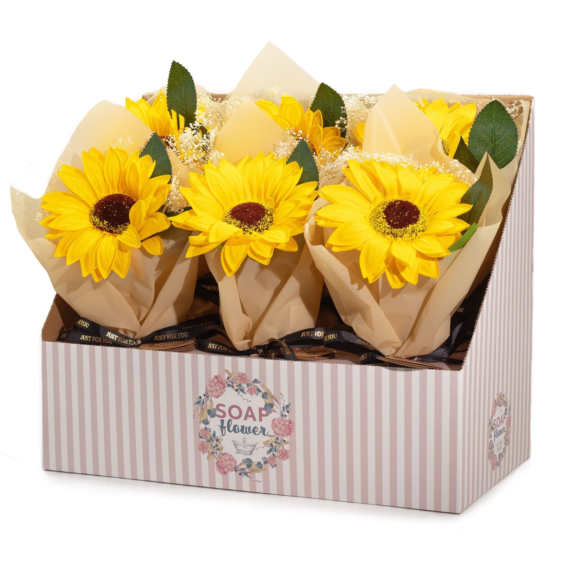 Bouquets of yellow soap sunflowers in brown paper packaging inside a decorative box with 'SOAP & FLORAL' branding.