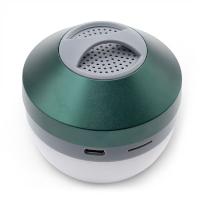 Green Camping Hanging Light & Mini Speaker hanging from tent ceiling with soft LED glow and Bluetooth music playing, compact cube design with carry loop visible