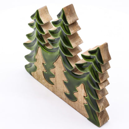 20×23cm 3D mango wood three pine trees decoration with deep green enamel branches on wooden base, styled on winter mantel with fairy lights and snow