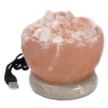 Himalayan salt fire bowl glowing with rotating rainbow colours, pink salt crystals lit from below, USB cable