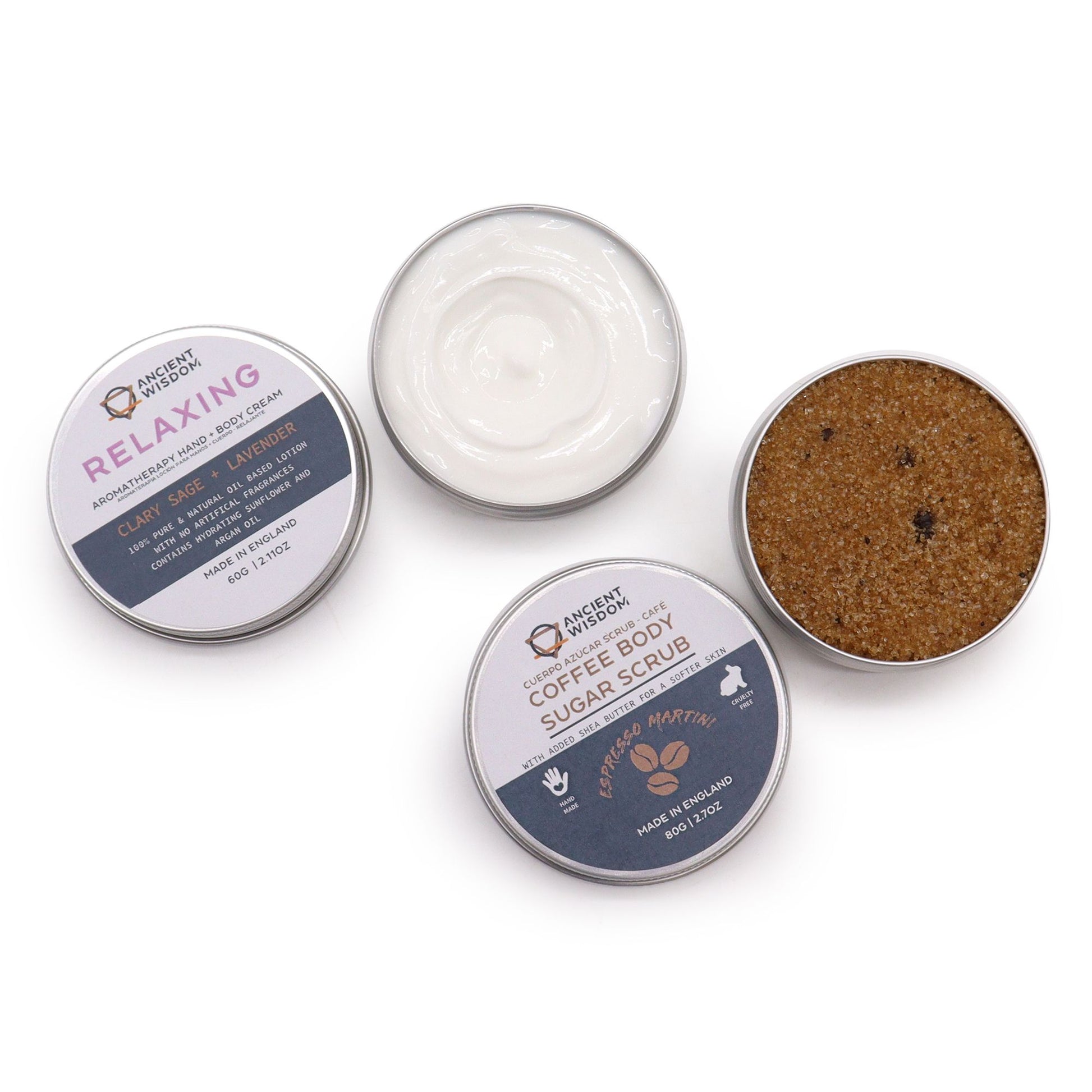 Mindful Moments Self Care Kit in elegant gift box open to reveal coffee sugar scrub jar, body cream, three bath salt vials, hyaluronic acid serum dropper bottle, fresh coffee beans and lavender on marble