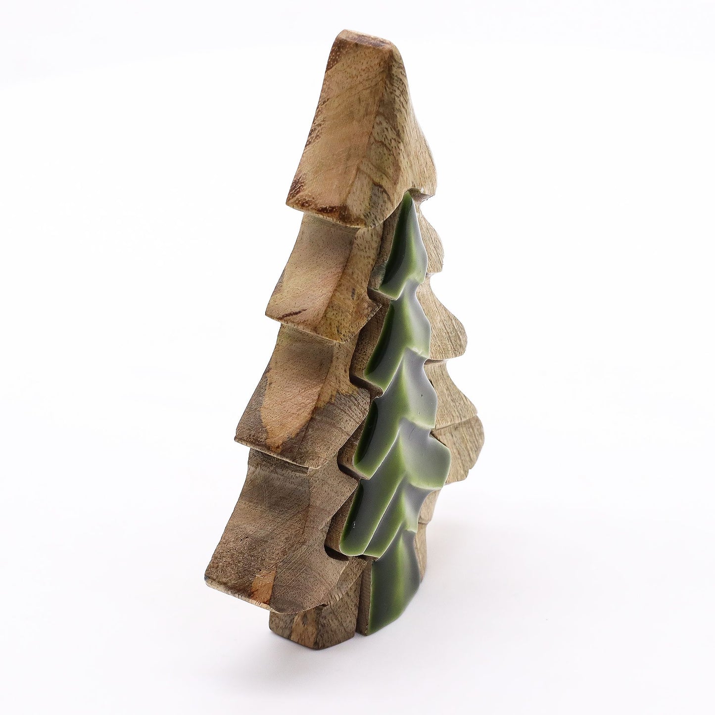 Wooden sculpture of a tree with green interior on a white background